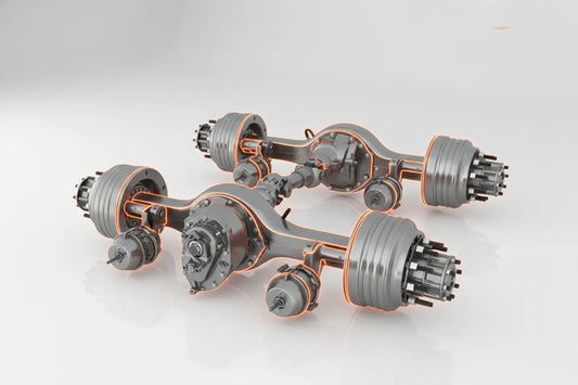 Ejes de servicio pesado Meritor Rockwell, Spicer Dana, Hendrickson y Eaton con acero forjado de alta densidad que garantizan integridad estructural, estabilidad direccional y seguridad en carretera, reduciendo riesgo de fallas catastróficas por fatiga de material en transporte de carga extrema